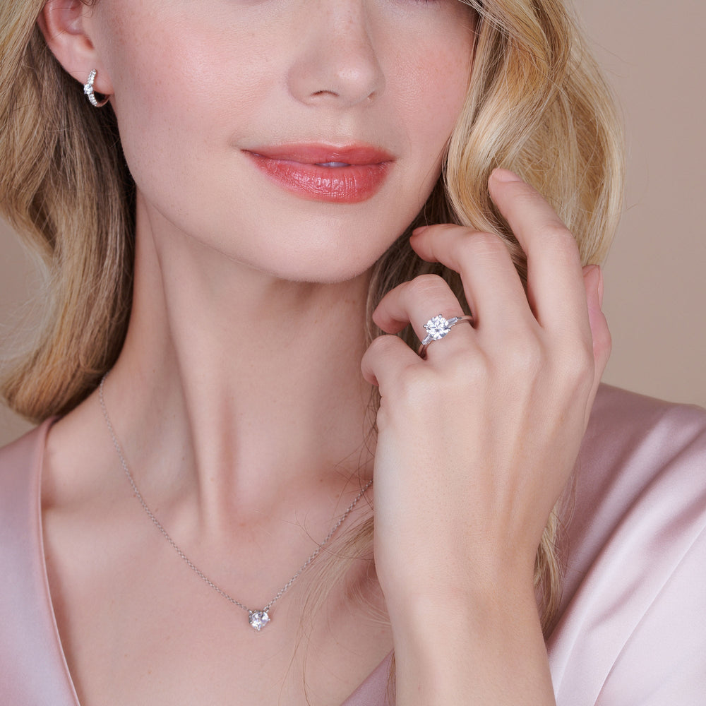 Model Wearing 2.51ct Emerald Three Stone Baguette Engagement Ring view