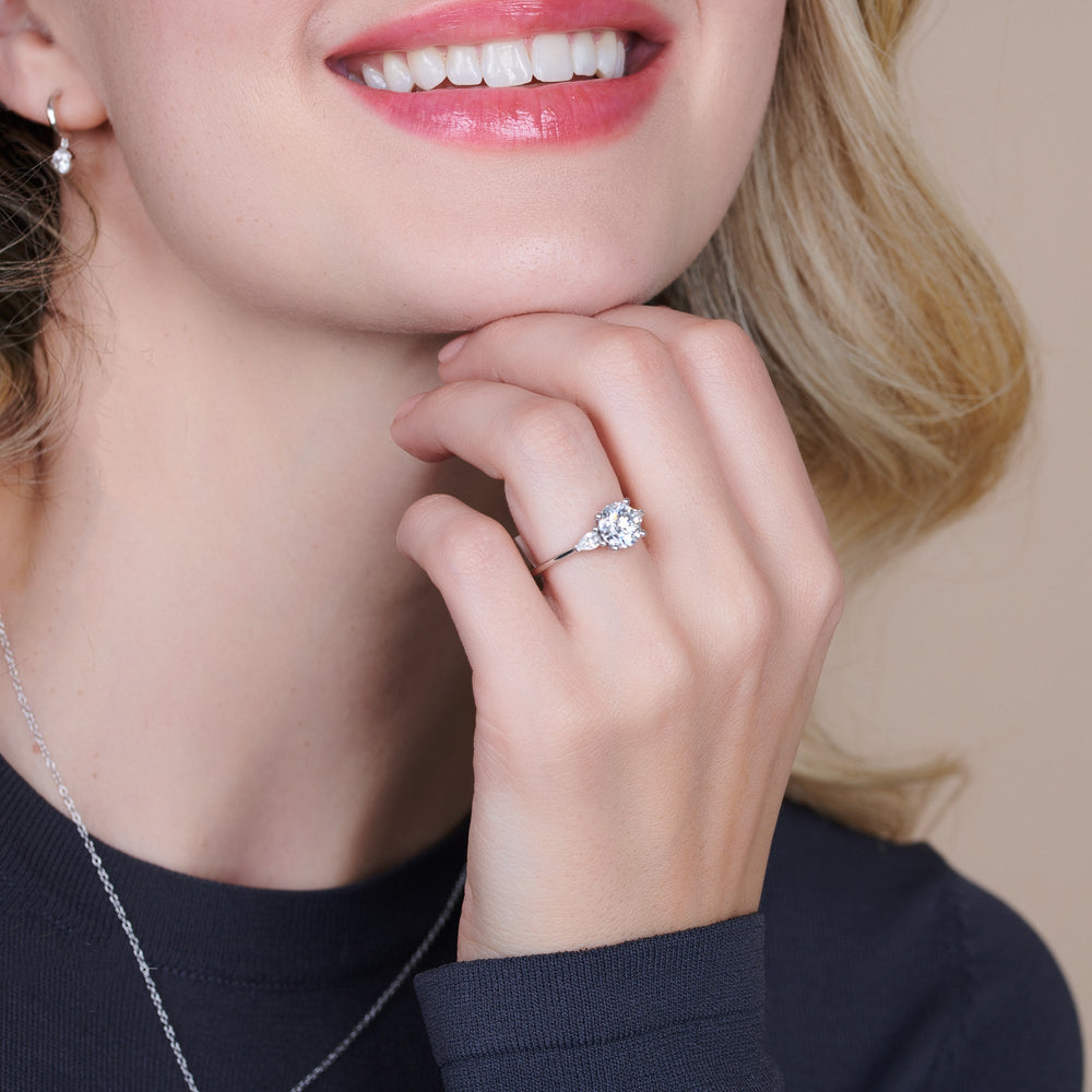 Model Wearing 2.50ct Round Three Stone Pear Engagement Ring view