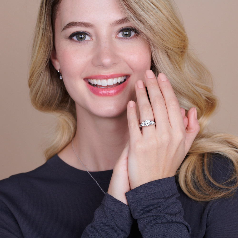 Model Wearing 4.08ct Round Seraphine Tulip Three Stone Engagement Ring view