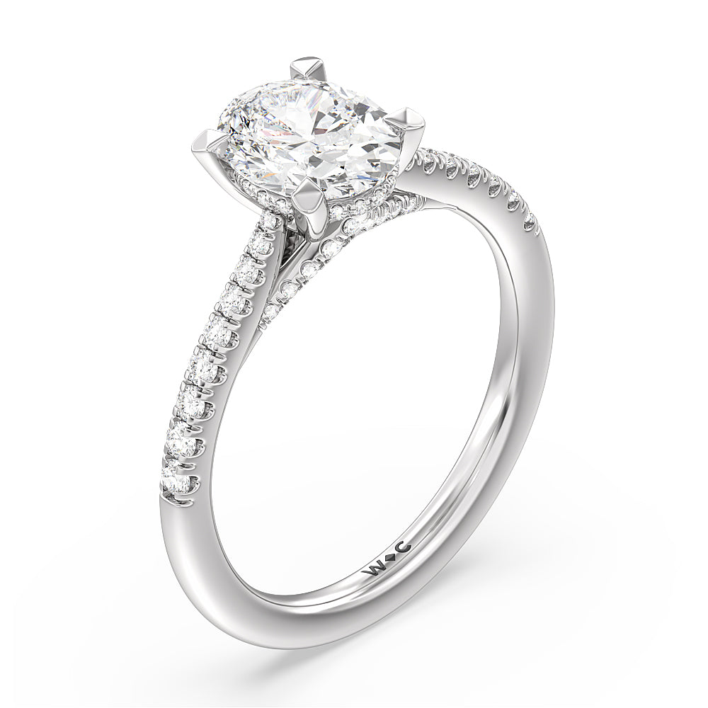 2.20ct Oval Tapered Pave Diamond Hidden Halo Engagement Ring with 2 1/2 Cut Diamond in 14KT Oval view 3

