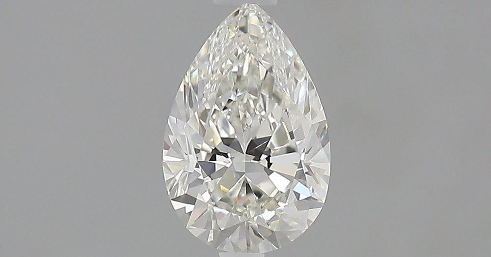0.81 Carat Pear Natural Diamond with  Cut Diamond in 14KT  view 1

