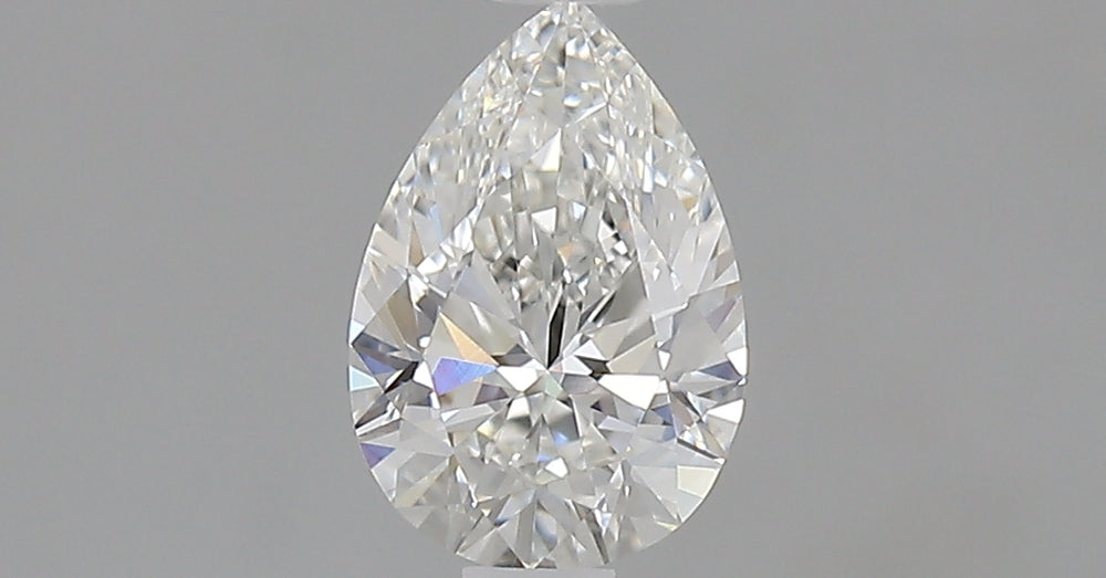 0.7 Carat Pear Natural Diamond with  Cut Diamond in 14KT  view 1
