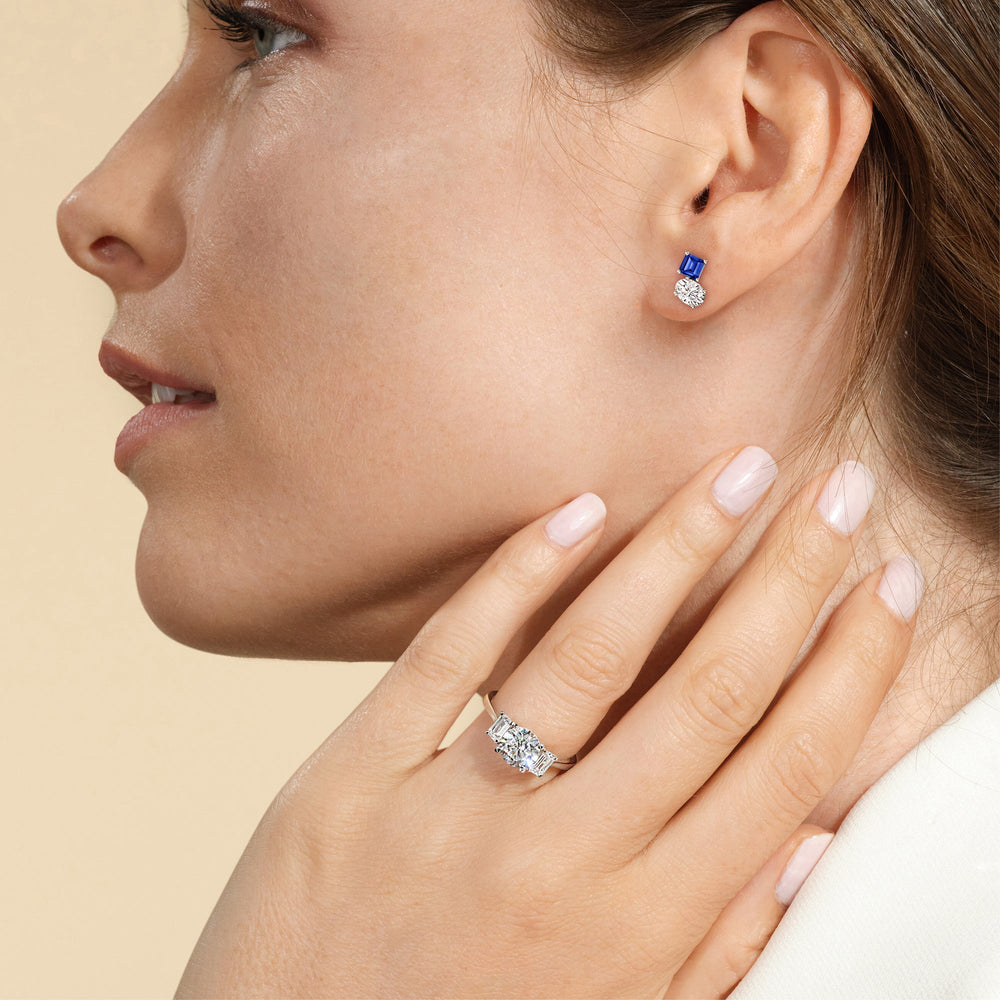 Model Wearing Toi et Moi Created Sapphire Square Emerald and Oval Diamond Stud Earrings view