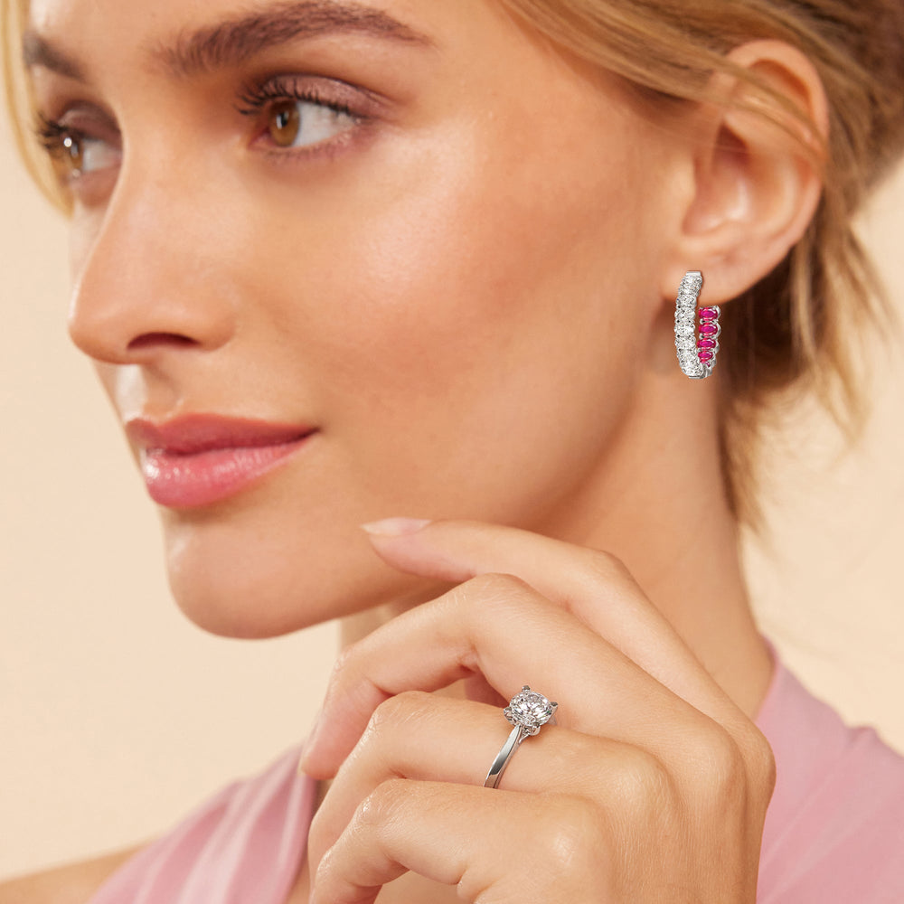 Model Wearing Inside-Out Oval Shape Diamond and Created Ruby Hoop Earring view