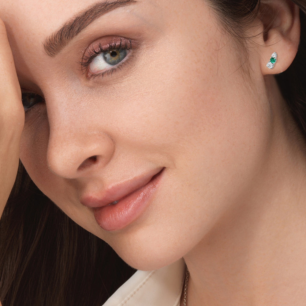 Model Wearing Trilogy Graduating Climber Diamond and Created Emerald Earrings view