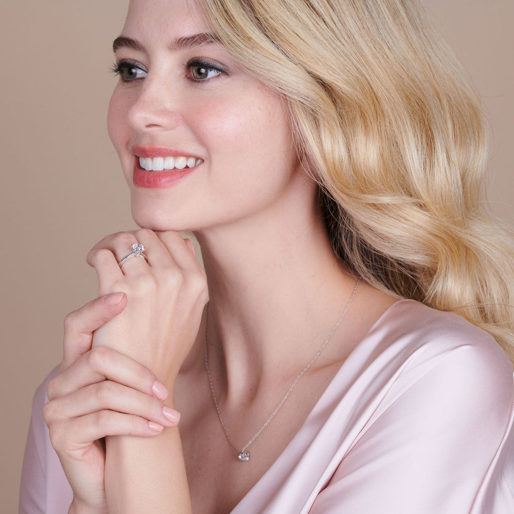 Model Wearing Adorned Hidden Accent Diamond Engagement Ring with Lab Grown Diamond view