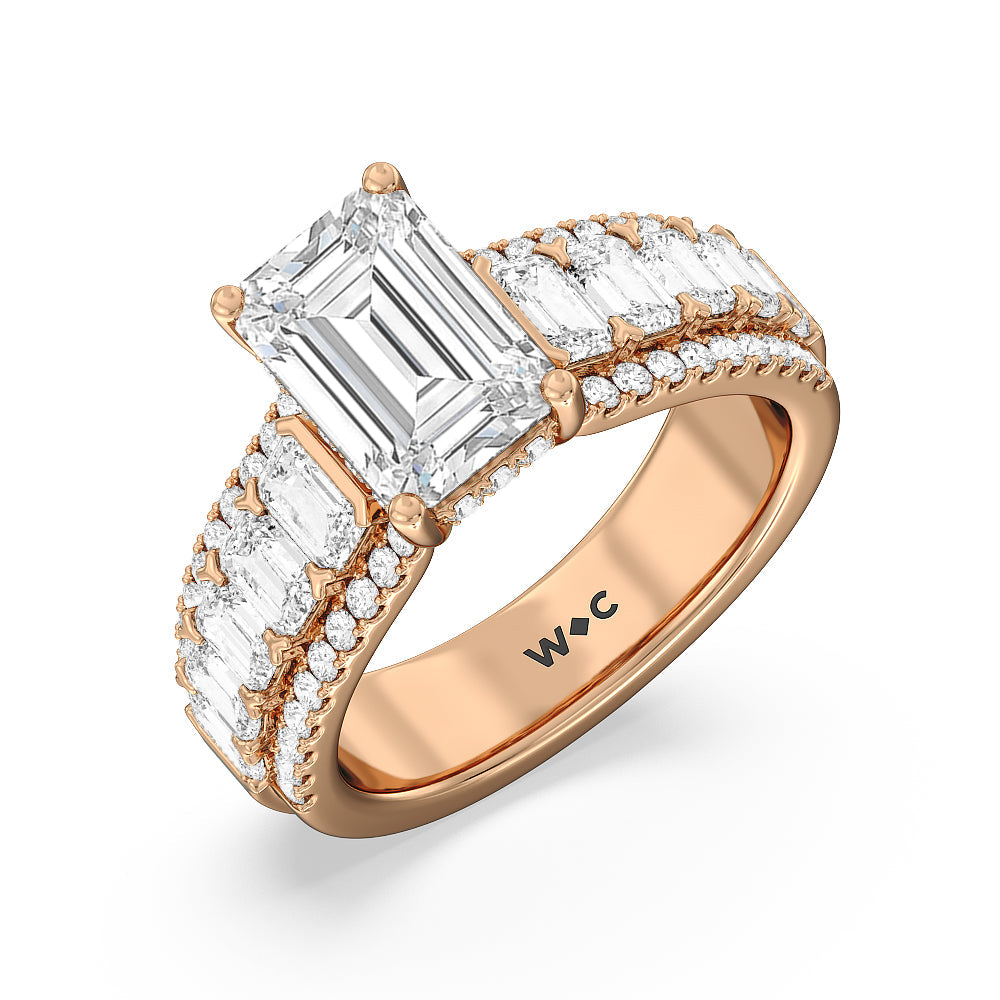 Emerald Side Stone Broad Band Hidden Halo Engagement Ring with Emerald Cut Diamond in 14KT Rose Gold view 3

