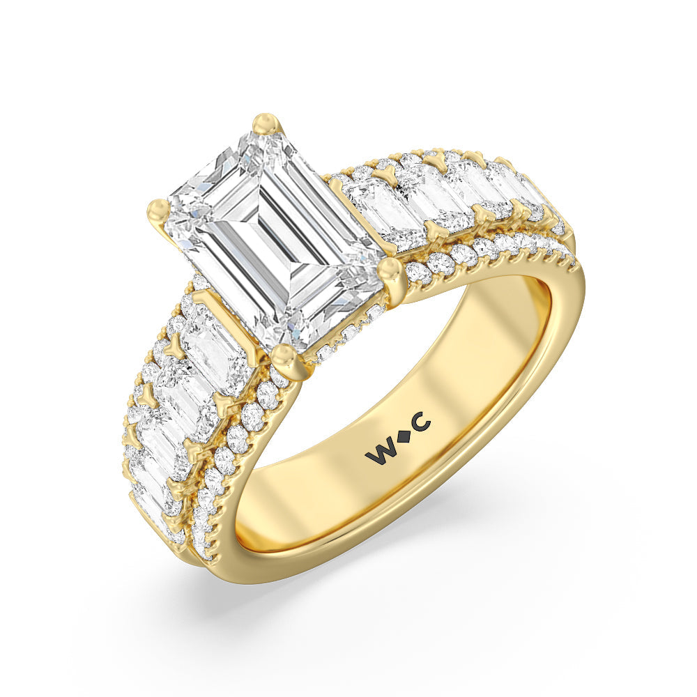 Emerald Side Stone Broad Band Hidden Halo Engagement Ring with Emerald Cut Diamond in 14KT Yellow Gold view 3
