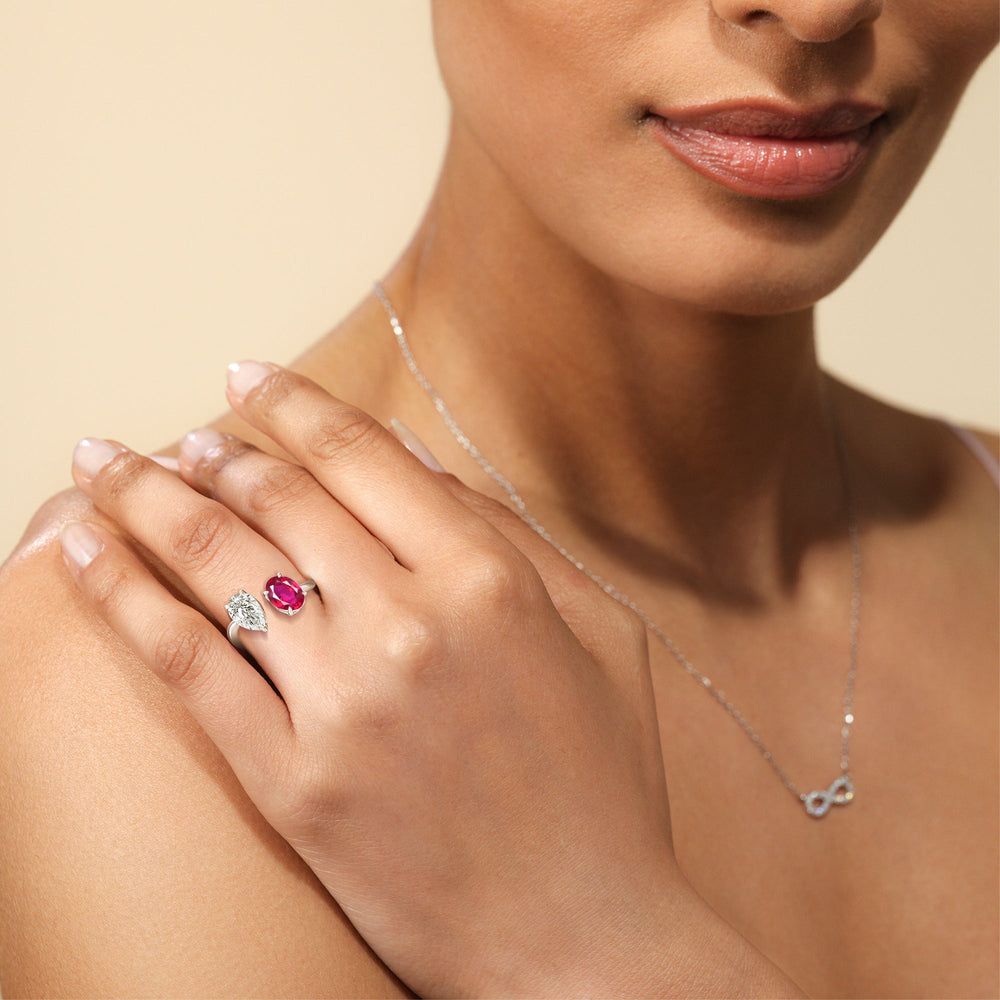 Model Wearing Toi et Moi Created Ruby Oval and Pear Diamond Curved Engagement Ring view