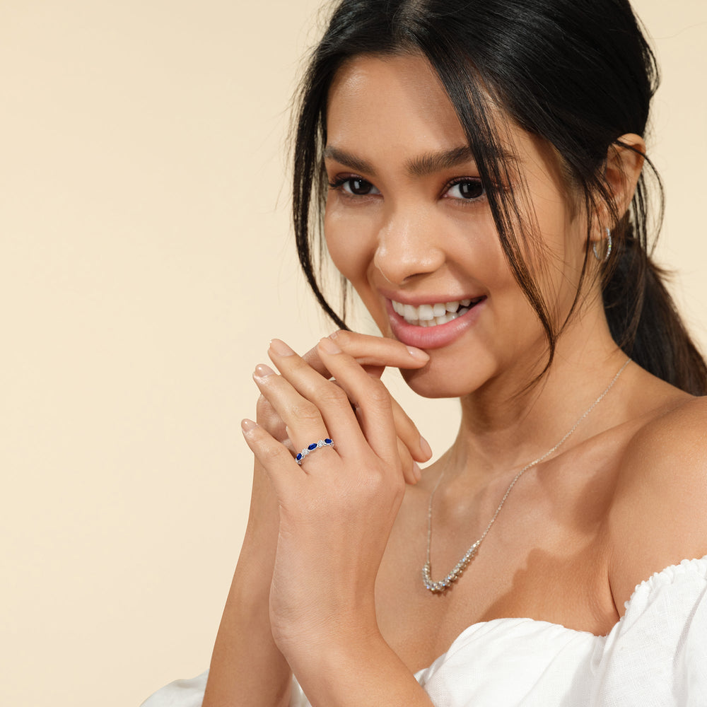 Model Wearing Alternating Created Sapphire Marquise and Round Diamond Anniversary Ring view