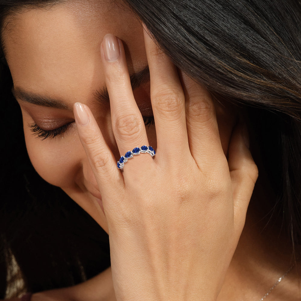 Model Wearing Trailing Created Sapphire Pear Anniversary Ring view