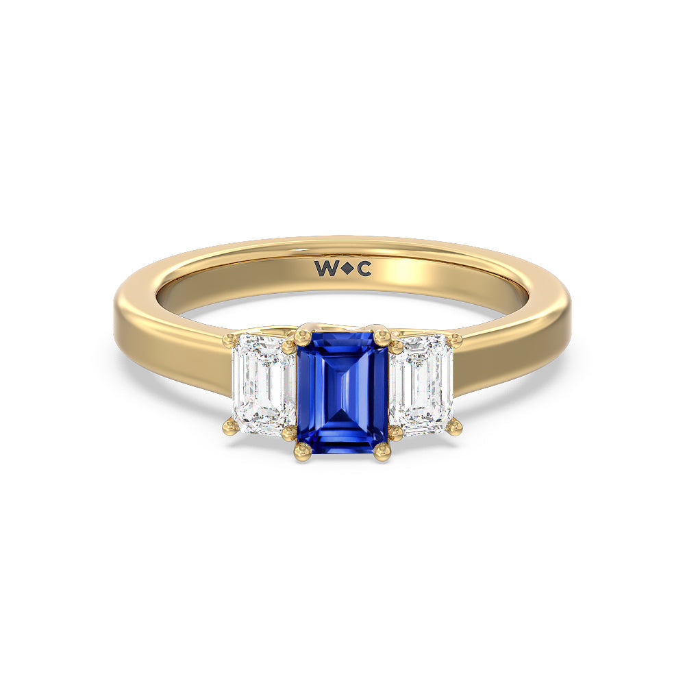 Created Sapphire Center And Emerald Cut Three Stone Diamond Ring with 14KT Yellow Gold Cut Diamond in 14KT Yellow Gold view 1
