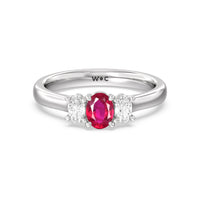Created Ruby Center and Oval Cut Three-Stone Diamond Ring