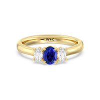 Created Sapphire Center And Oval Cut Three Stone Diamond Ring