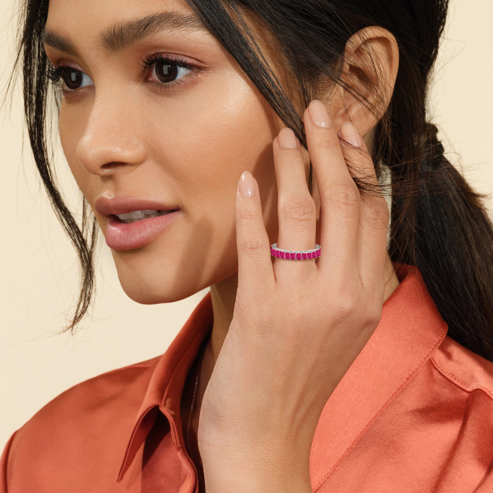 Model Wearing Created Ruby Emerald Split Prong Basket Eternity Ring Size 7.25 view