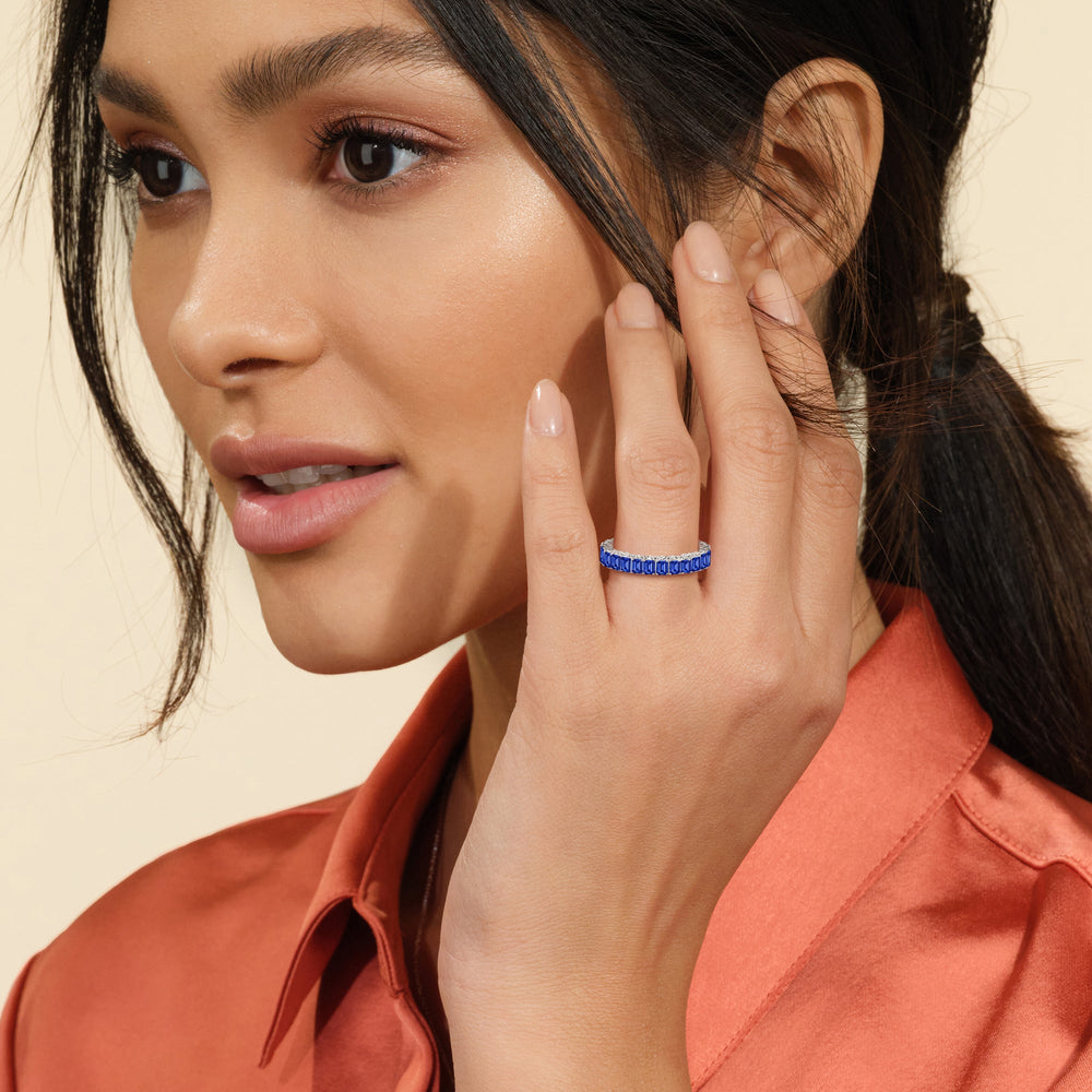 Model Wearing Created Sapphire Emerald Split Prong Basket Eternity Ring Size 6.25 view