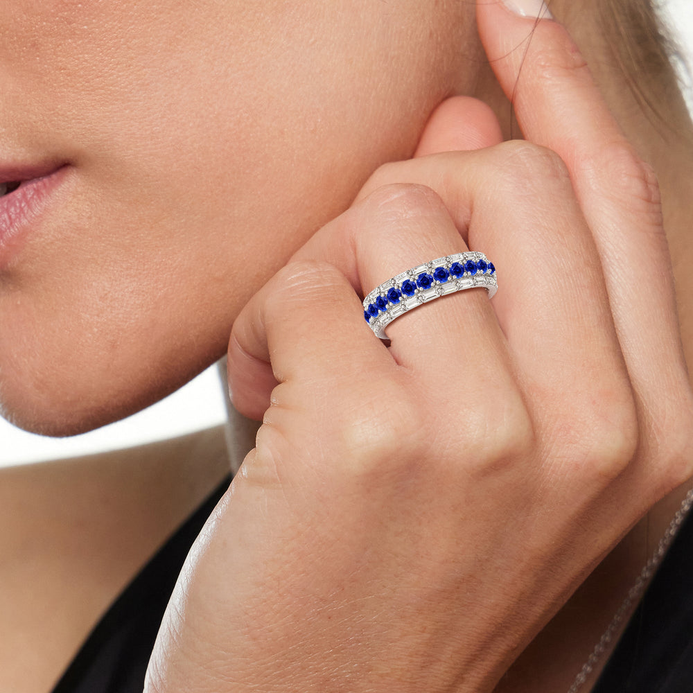 Model Wearing Baguette Edge and Created Sapphire Round Stones Eternity Ring view