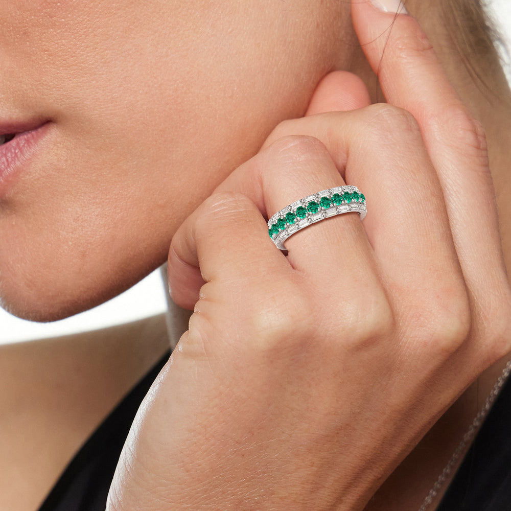 Model Wearing Baguette Edge and Created Emerald Round Stones Eternity Ring view