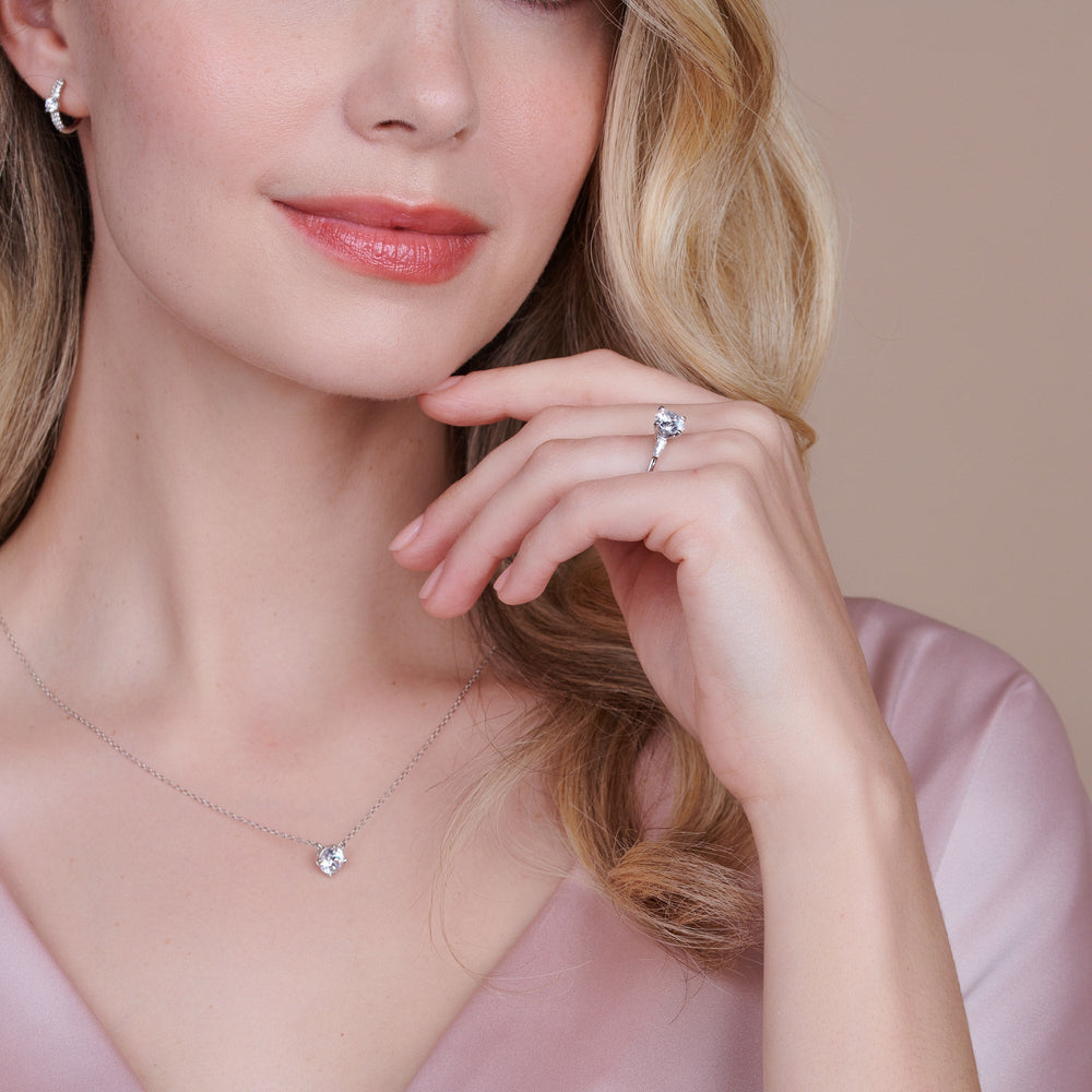Model Wearing Three Stone Baguette Engagement Ring view