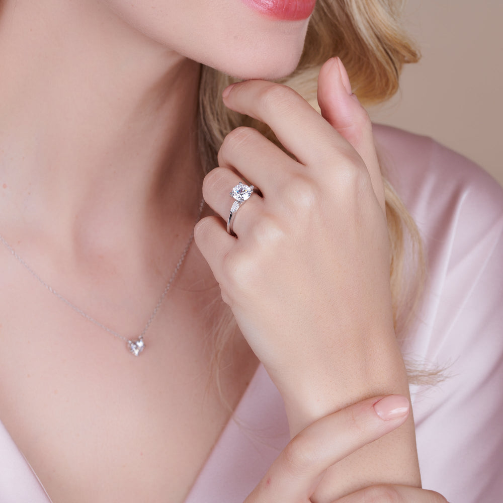 Model Wearing Three Stone Baguette Engagement Ring view