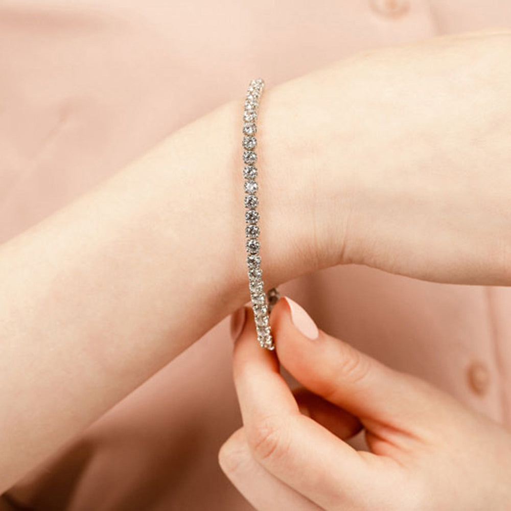 Model Wearing Lotus Prong Round Lab Diamond Tennis Bracelet view