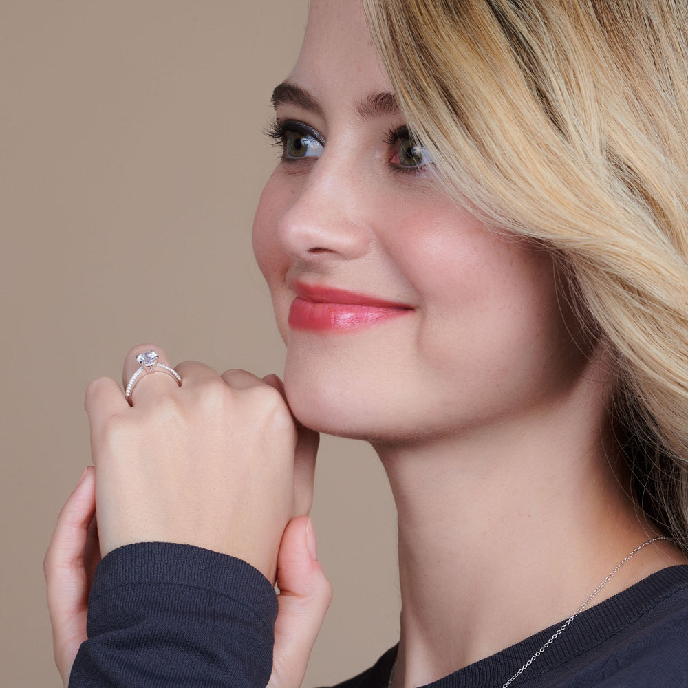 Model Wearing Tapered Knife Edge Hidden Halo Engagement Ring view