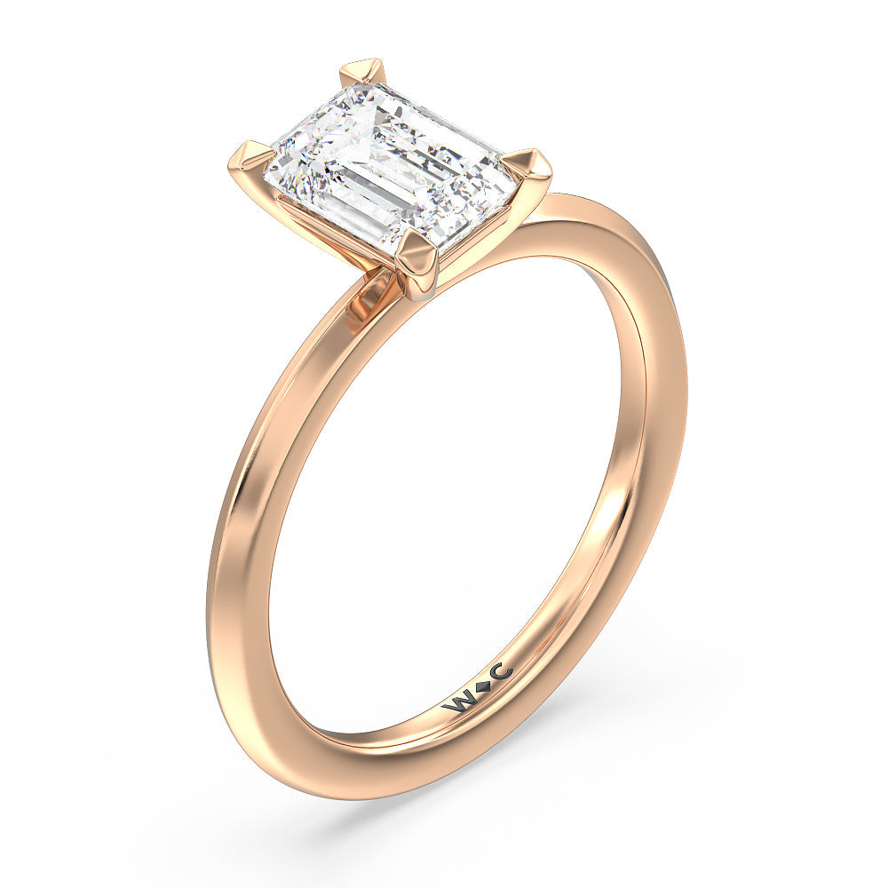 Petite Knife Edge Solitaire Engagement Ring with Emerald Cut Diamond in 14KT Rose Gold view 3
