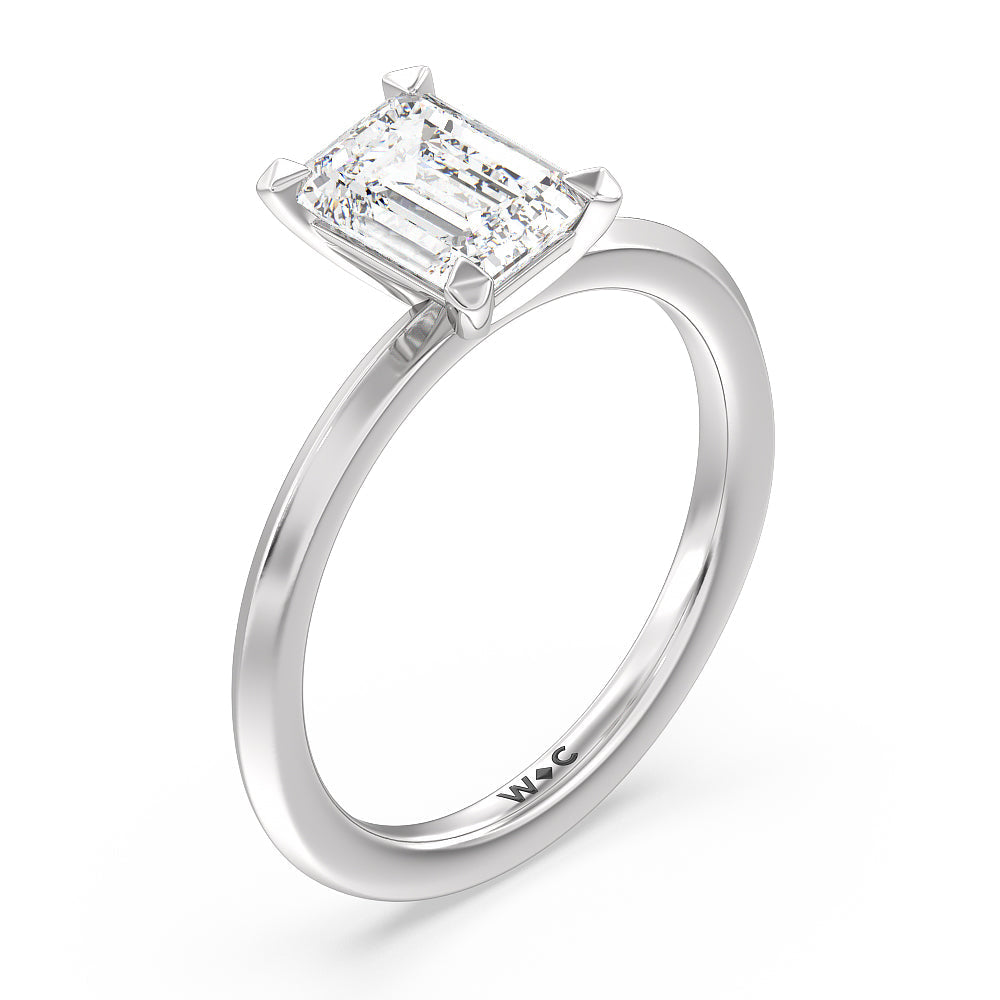 Petite Knife Edge Solitaire Engagement Ring with Emerald Cut Diamond in 14KT Platinum view 3
