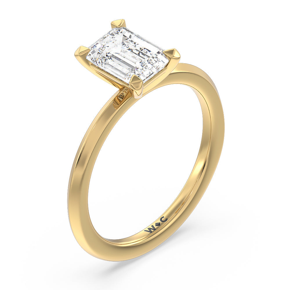 Petite Knife Edge Solitaire Engagement Ring with Emerald Cut Diamond in 14KT Yellow Gold view 3
