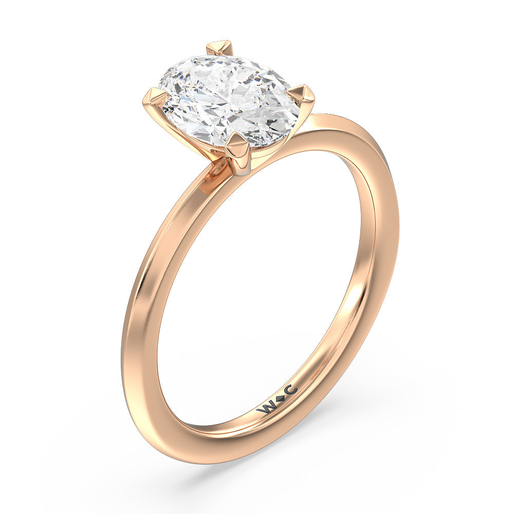 Petite Knife Edge Solitaire Engagement Ring with Oval Cut Diamond in 14KT Rose Gold view 3

