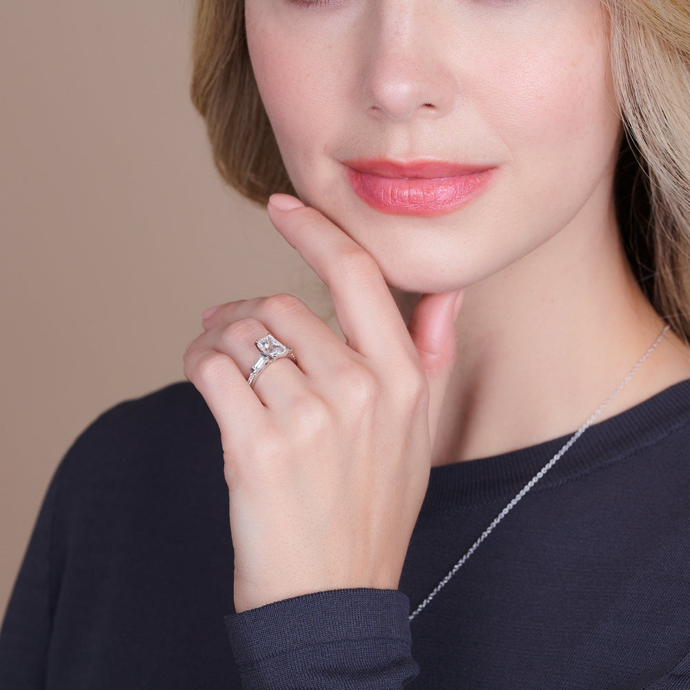 Model Wearing 1 3/4 cttw Round Cut Three Stone Tapered Baguette Diamond Engagement Ring view