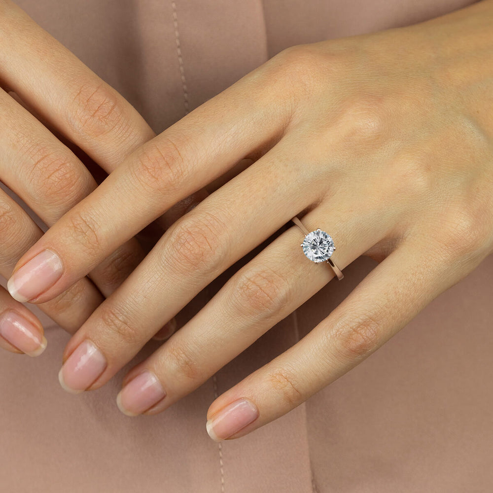 Model Wearing Sleek Cathedral Solitaire Engagement Ring view