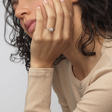 Model Wearing Classic Four Prong East West Engagement Ring view
