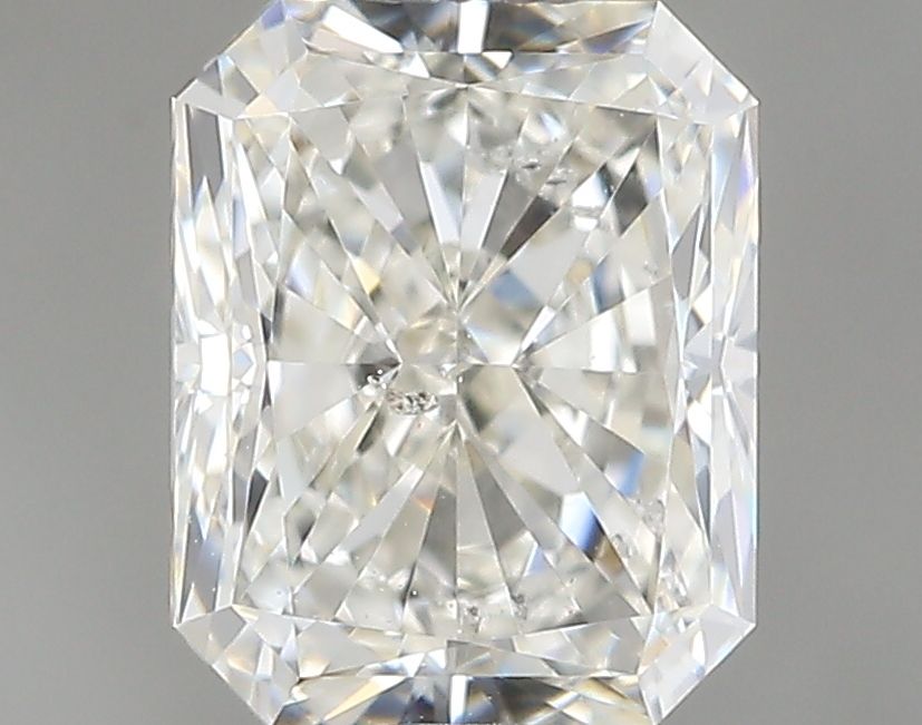 0.7 Carat Radiant Natural Diamond with  Cut Diamond in 14KT  view 1
