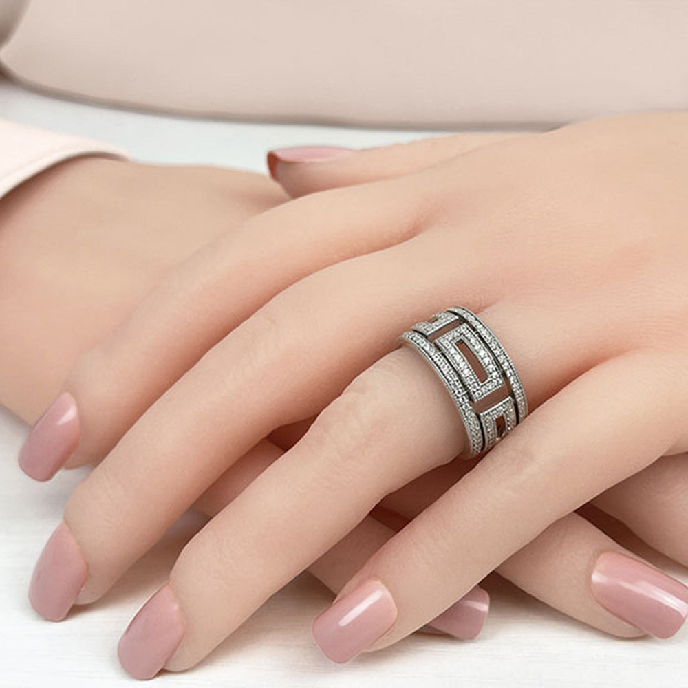 Model Wearing Geometric Cut-Out Round Diamond Wide Eternity Ring view